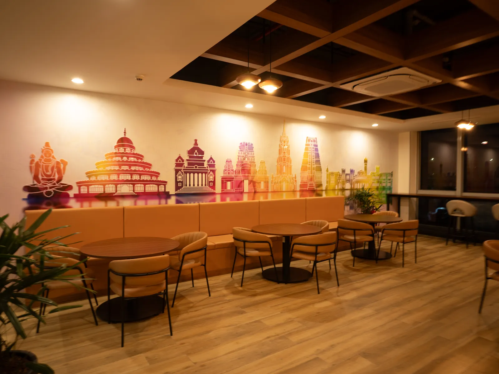 Cafeteria with colourful Indian-architecture mural — Moschip